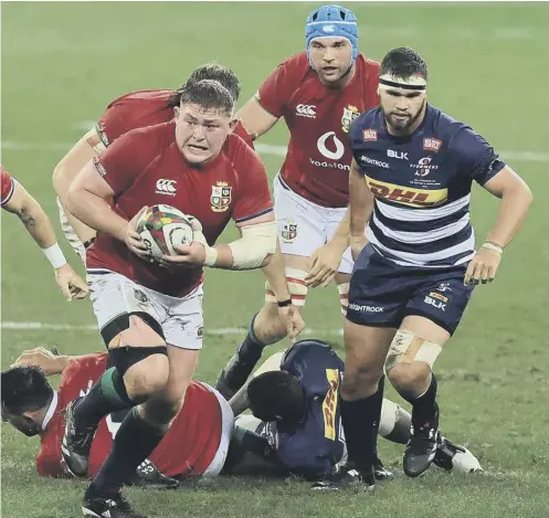  ??  ?? 0 Tadhg Furlong on the charge for the Lions against the Stormers where he had Rory Sutherland alongside him in the front row