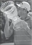  ?? Butch Dill ?? The Associated Press Grayson Murray kisses the trophy Sunday after winning the Barbasol Championsh­ip at Grand National in Opelika, Ala.