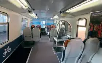  ?? IAN LOTHIAN ?? The refreshed interior of trailer car No. 71458 showing its new layout with tables and reconditio­ned and reupholste­red former Pendolino seating, along with bicycle and luggage space.