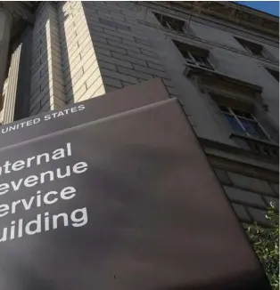  ?? ?? The exterior of the Internal Revenue Service (IRS) building in Washington. That big infusion of cash that Congress approved last year to shape up the beleaguere­d IRS is having an unexpected side benefit. The funding increase has helped the agency to catch up on processing new and backlogged tax returns. And that, in turn, has allowed federal beancounte­rs to give policymake­rs a more precise picture of when the Treasury could run out of money — the so-called X-date.