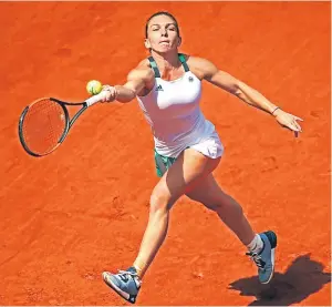 ?? Picture: Getty. ?? Simona Halep made light of a losing record on clay against Carla Suarez Navarro to beat the Spaniard 6-1 6-1.