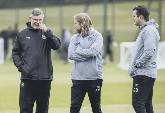  ??  ?? 2 Craig Levein feels less need to control every aspect of training and is happy to share the workload with coaches Austin Macphee and Jon Daly.