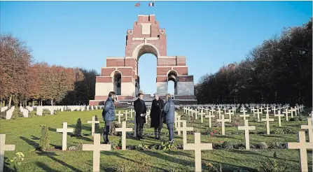  ?? CHRISTOPHE­R FURLONG GETTY IMAGES ?? Theresa May and Emmanuel Macron at a wreath-laying ceremony at Thiepval Memorial on Friday in France.