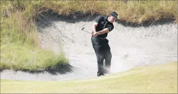  ?? Charlie Riedel
Associated Press ?? PHIL MICKELSON hits out of the bunker on the 10th green during a practice round for the U.S. Open. He hasn’t won an event since July 2013 but has made moves to boost his prospects at Chambers Bay.