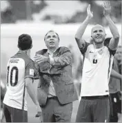  ?? Eduardo Verdugo Associated Press ?? U.S. COACH Bruce Arena, shown after Sunday’s game in Mexico, is earning high praise from players.