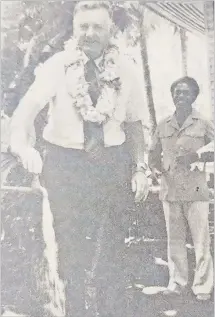  ?? Picture: FILE ?? American Embassy official Robert Craig turns on the tap and sets the water gushing as he officially opens Natalau Village’s new water supply. Behind him is Apisai Tora, the landowners’ leader from the area who initiated talks with the embassy to get financial help for the project.