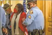  ?? Alyssa Pointer Atlanta Journal-Constituti­on ?? STATE REP. PARK CANNON is arrested Thursday after she knocked on Gov. Brian Kemp’s door at the state Capitol in protest as he signed the voting limits.