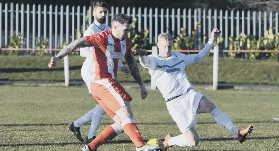  ??  ?? Seaham Red Star (red/white) pulled off a shock victory over Consett (white) on Saturday.