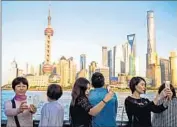  ?? Zhang Peng
LightRocke­t via Getty Images ?? TOURISTS in Shanghai may not need a visa depending on how long they stay, but better safe than sorry.