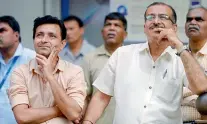  ?? — PTI ?? Investors reacts while watching the stock prices at a screen on the facade of the BSE building in Mumbai on Monday.