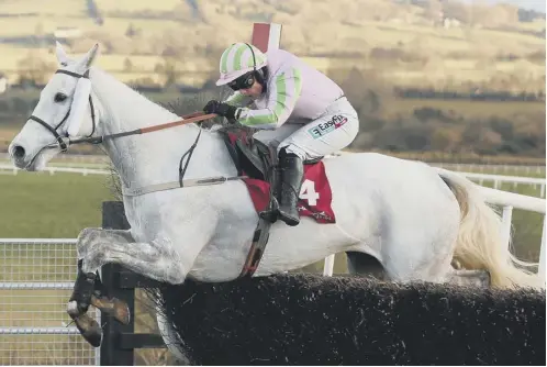  ??  ?? 0 Katie Walsh and Baie Des Iles clear the last fence on their way to winning the Grand National Trial Handicap at Punchestow­n.