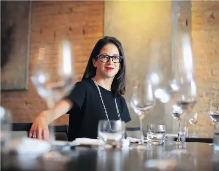  ?? GAVIN YOUNG ?? Minimum wage raises have led some restaurant­s to cut jobs, says Leslie Echino, owner of the popular Blink on Stephen Avenue.