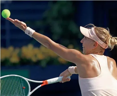  ?? Photos by Shihab ?? Vesnina serves during her straight sets victory against Pengin at the Dubai Duty Free Tennis Stadium on Monday. —