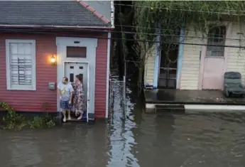  ?? BRETT DUKE/THE ASSOCIATED PRESS ?? Some residents are losing faith in public officials after rain caused the city’s pump system to malfunctio­n.