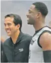  ?? DAVID SANTIAGO/MIAMI HERALD ?? Heat guard Dwyane Wade and coach Erik Spoelstra talk during the first day of training camp.