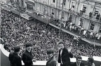  ??  ?? The Beatles on the balcony of the St George Hotel, Wellington, in 1964. The band’s message reached a huge audience.