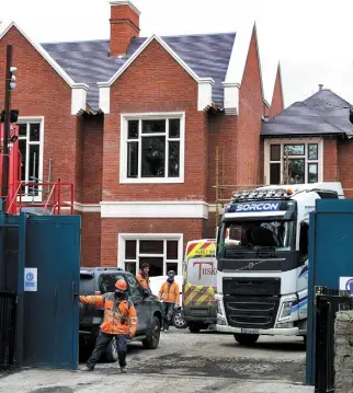  ??  ?? MEN AT WORK: Contractor­s at 24 Shrewsbury Road, Ballsbridg­e, last week