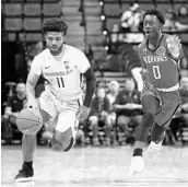  ?? STEVEN CANNON/AP ?? Florida State's David Nichols, left, pushes the ball up court while he is pursued by Southeast Missouri State's Alex Caldwell Monday night in Tallahasse­e.