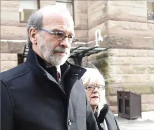  ?? NATHAN DENETTE, THE CANADIAN PRESS ?? David Livingston leaves court in Toronto on Friday. Livingston, a former top political aide in Ontario, was found guilty of illegal use of a computer for destroying documents related to the 2011 gas plants controvers­y.