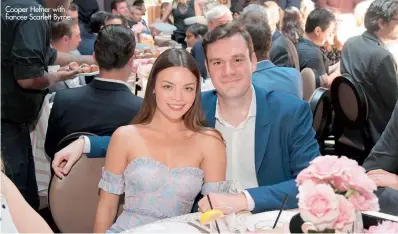  ??  ?? Cooper Hefner with fiancee Scarlett Byrne.