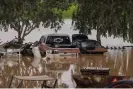  ?? Photograph: David McNew/Getty Images ?? A flooded farm in the aftermath of a series of atmospheri­c river systems on 10 March 2023 near Strathmore, California.