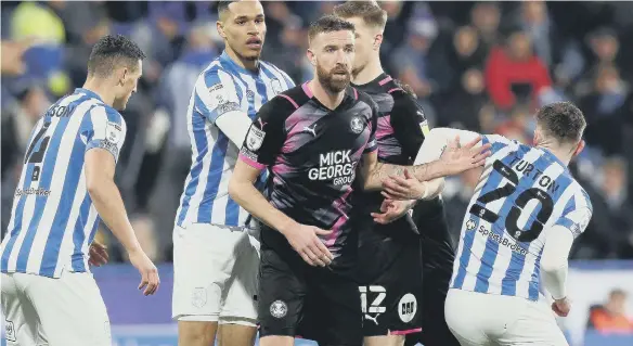  ?? ?? Mark Beevers in his last Posh appearance at Huddersfie­ld on March 4. Photo: Joe Dent/theposh.com.