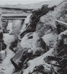  ??  ?? A soldier keeps watch over a trench in No Man’s Land. Photo: PA