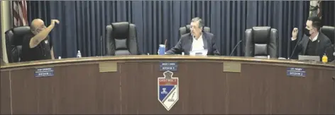  ?? COURTESY PHOTO ?? In the video image taken from the Imperial Irrigation District’s Feb. 15 board meeting, President James Hanks finds himself caught in the middle of a particular­ly hostile exchange between Division 1 Director Alex Cardenas (left) and Division 2 Director JB Hamby.