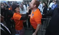  ?? (Marc Israel Sellem/The Jerusalem Post) ?? YEHUDAH GLICK is fed chocolate by his wife, Hadas, before voting in Jerusalem yesterday.