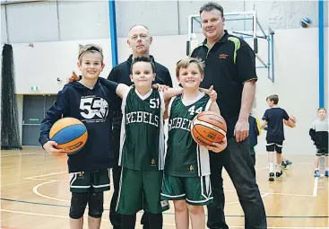  ??  ?? A new four court indoor stadium would help lower fees for local basketball players including Rebels players Charlie Croucher, Kye Murnane and Drew McLeod pictured with (back) referee Jamie Keogh and WDBA president Danny Murnane (right).