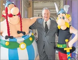  ??  ?? Comic-book artist Albert Uderzo with cosplayers as his intrepid creations Obelix and Asterix in Paris in 2015