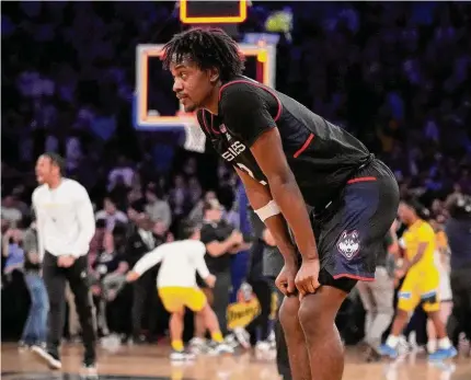  ?? John Minchillo/Associated Press ?? UConn’s Tristen Newton reacts after losing to Marquette in the semifinals of the Big East Tournament on Friday in New York.