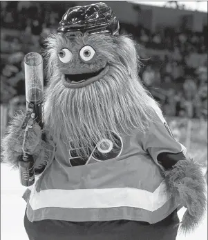  ?? AP PHOTO ?? The Philadelph­ia Flyers mascot, Gritty, takes to the ice during the first intermissi­on of the a pre-season game against the Boston Bruins in Philadelph­ia on Sept. 24.