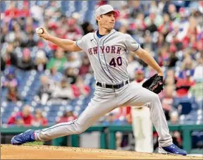  ?? Laurence Kesterson / Associated Press ?? New York’s Chris Bassitt allowed one run in 52⁄3 innings against the Phillies on Sunday to get the win in Game 2 of the doublehead­er.
