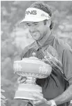  ?? Eric Gary / Associated Press ?? Bubba Watson wears a big smile to match his big trophy after he was the last man standing Sunday at Austin Country Club.