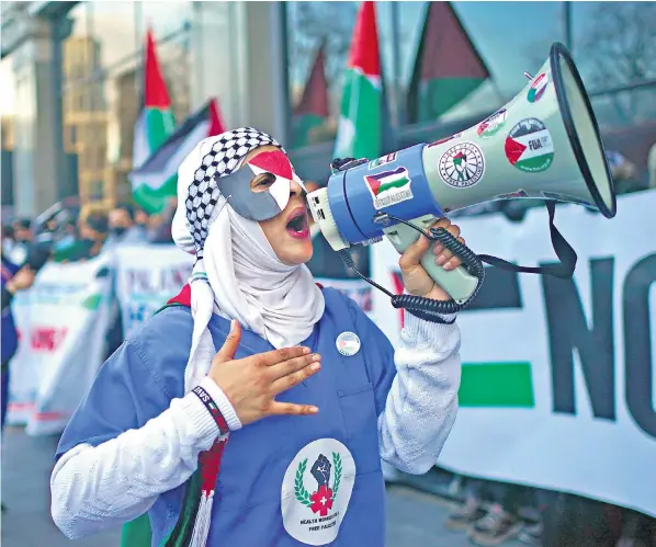  ?? ?? Protesters blockade the entrance to NHS England’s headquarte­rs in central London demanding the cancellati­on of its contract with Palantir, which campaign groups say supplies advanced technology to Israel’s military