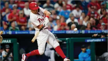  ?? MATT ROURKE — THE ASSOCIATED PRESS ?? The Phillies’ Rhys Hoskins hits a three-run home run off Miami starter Trevor Rogers during the fourth inning Tuesday at Citizens Bank Park. Despite Hoskins’ two-homer, six-RBI effort, the Marlins would win by 11-9.