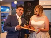  ??  ?? Newlyweds Paul and Jenny Cotter pictured with the donuts.