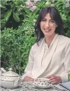  ?? Pictures by Harry Cory Wright, Harper’s Bazaar ?? Drinking tea in the garden, Mrs Cameron is wearing a £210 texture voile blouse from her Cefinn range