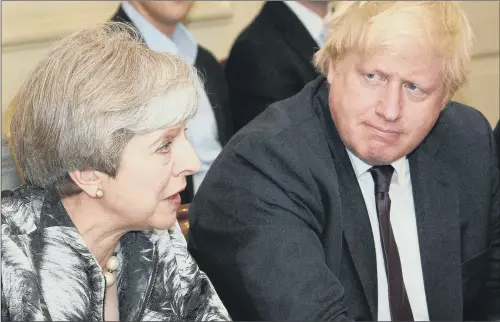  ??  ?? TORIES AT WAR: Prime Minister Theresa May with Boris Johnson who has launched a scathing attack on her Brexit strategy, saying it has put UK in a ‘suicide vest’.