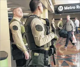  ?? Irfan Khan Los Angeles Times ?? L.A. COUNTY sheriff ’s transit police at an entrance to the Metro Red and Purple lines. The department has faced criticism from transit officials and riders.