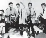  ??  ?? Those were the days: The Quarrymen with drummer Hanton, McCartney (left on guitar) and Lennon (singing)