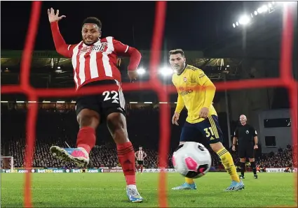  ??  ?? Lys Mousset scores at Brammall Lane last night to ensure Sheffield United claimed all three points