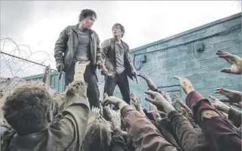  ?? Gene Page AMC ?? Michael Traynor as Nicholas and Steven Yeun as Glenn Rhee - The Walking Dead _ Season 6, Episode 3 Photo Credit: Gene Page/AMC