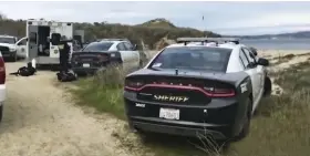  ??  ?? Search: Sheriff’s vehicles at Monastery Beach in Carmel