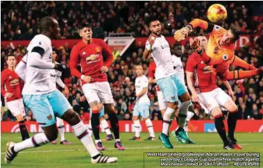  ??  ?? West Ham United goalkeeper Adrian makes a save during yesterday’s League Cup quarterfif­i nal match against Manchester United at Old Trafford. – REUTERSPIX