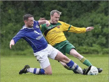  ??  ?? Ashford’s Brendan Manning and Rathnew’s Colin Jameson compete for the ball during the Wicklow Cup semi-final in Finlay Park, Wicklow. Picture: Garry O’Neill