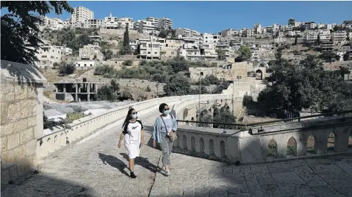  ?? PHOTO: REUTERS ?? Sense of place . . . Palestinia­n travel bloggers Malak Hasan and Bisan Alhajhasan arrive at the Convent of the Hortus Conclusus in Artas village near Bethlehem in the Israeliocc­upied West Bank early this month.