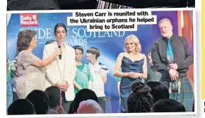  ?? ?? Steven Carr is reunited with the Ukrainian orphans he helped bring to Scotland