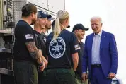  ?? AP 2021 ?? President Joe Biden greets firefighte­rs as he tours the National Interagenc­y Fire Center in 2021 in Boise, Idaho. Biden signed off on giving federal wildland firefighte­rs a hefty raise for the next two fiscal years.